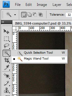 Right click on the Quick Selection Tool at the leftside of the interface. Select the Magic Wand Tool.