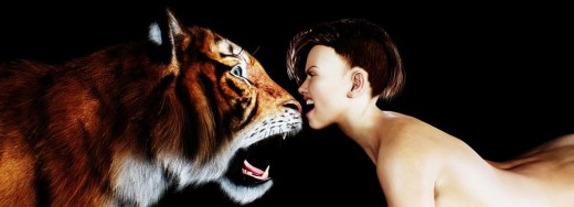 Fantasy art of a woman head to head and growling at a tiger.